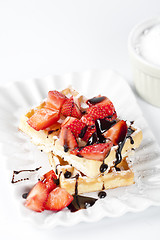 Image showing Belgium waffers with sugar powder, strawberries and chocolate on