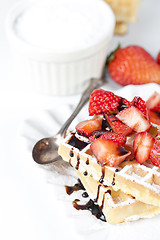 Image showing Belgium waffers with sugar powder, strawberries and chocolate on