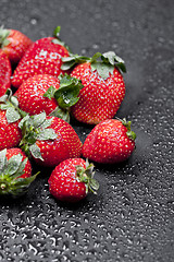 Image showing Fresh ripe strawberry with water drops closeup.