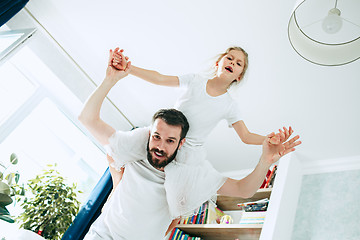 Image showing Father and his six years kid girl at home