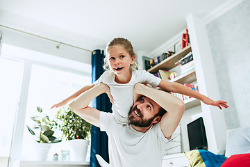 Image showing Father and his six years kid girl at home