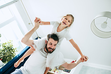 Image showing Father and his six years kid girl at home