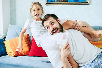 Image showing Father and his six years kid girl at home