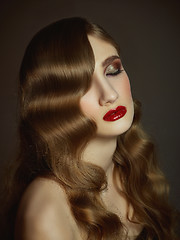 Image showing Close-up indoor portrait of lovely girl with colorful hair. Studio shot of graceful young woman with long haircut