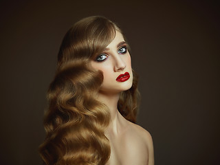 Image showing Close-up indoor portrait of lovely girl with colorful hair. Studio shot of graceful young woman with long haircut