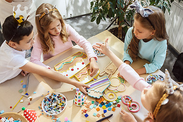 Image showing Girl birthday decorations. table setting with cakes, drinks and party gadgets.