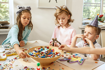 Image showing Girl birthday decorations. table setting with cakes, drinks and party gadgets.