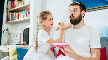 Image showing Father and his six years kid girl at home