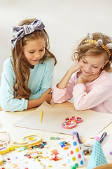 Image showing Girl birthday decorations. table setting with cakes, drinks and party gadgets.