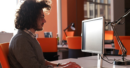 Image showing businessman working using a computer in startup office