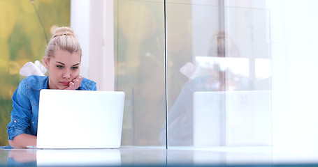 Image showing young women using laptop computer on the floor