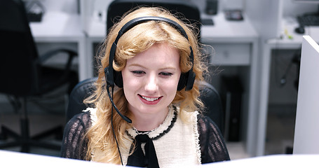 Image showing female call centre operator doing her job