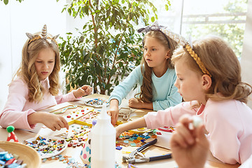 Image showing Girl birthday decorations. table setting with cakes, drinks and party gadgets.