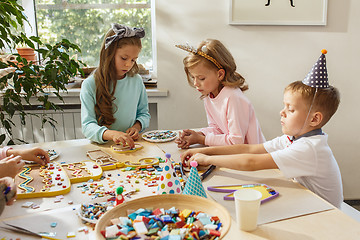 Image showing Girl birthday decorations. table setting with cakes, drinks and party gadgets.