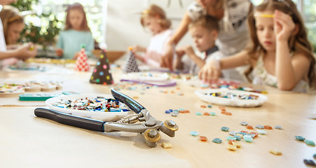 Image showing Girl birthday decorations. table setting with cakes, drinks and party gadgets.