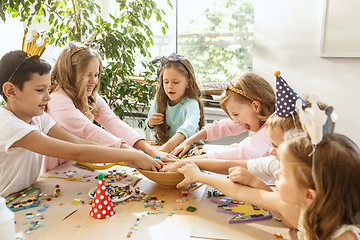 Image showing Girl birthday decorations. table setting with cakes, drinks and party gadgets.