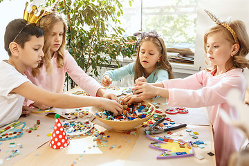 Image showing Girl birthday decorations. table setting with cakes, drinks and party gadgets.