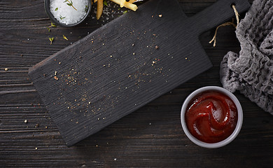 Image showing black wooden cutting board