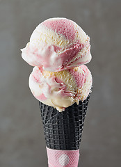 Image showing Ice cream balls in black waffle cone