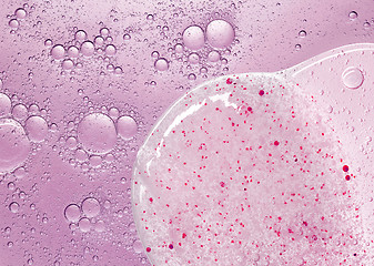 Image showing cosmetic liquid with bubbles and scrub gel textures