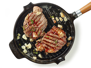 Image showing pan of grilled steaks on white background