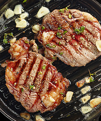 Image showing grilled steaks on grilling pan