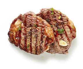 Image showing grilled steaks on white background