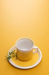 Image showing Ceramic teacup on yellow background