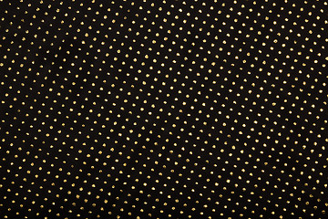 Image showing Black textile with golden metallic dots decor