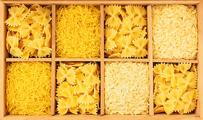 Image showing Wooden box storing a variety of pasta