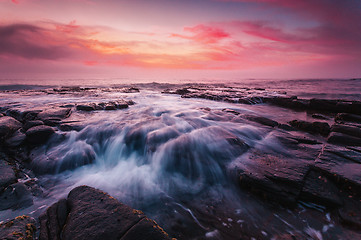 Image showing Sunrise at the tessellated rocks of Garie Beach Australia