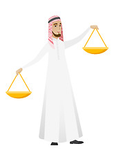 Image showing Muslim businessman holding balance scale.