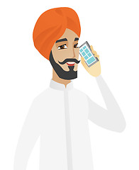 Image showing Hindu businessman talking on a mobile phone.