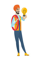 Image showing Hindu electrician holding bright light bulb.