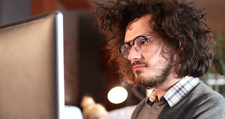 Image showing businessman working using a computer in startup office