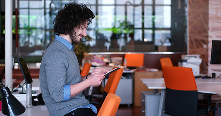 Image showing businessman using tablet computer