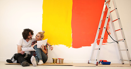 Image showing Happy young couple relaxing after painting