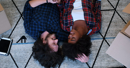 Image showing Top view of attractive young multiethnic couple