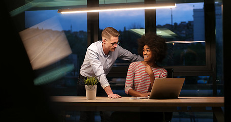 Image showing Multiethnic startup business team in night office