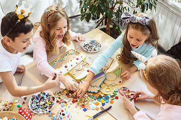 Image showing Girl birthday decorations. table setting with cakes, drinks and party gadgets.