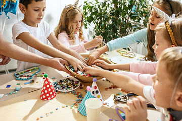 Image showing Girl birthday decorations. table setting with cakes, drinks and party gadgets.