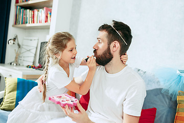 Image showing Father and his six years kid girl at home