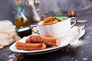 Image showing sausages with cabbage