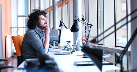 Image showing businessman working using a laptop in startup office