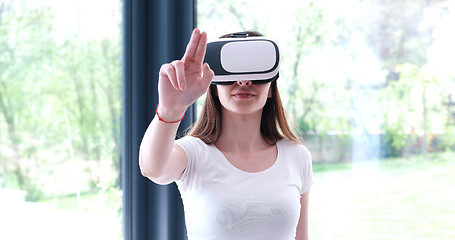 Image showing woman using VR-headset glasses of virtual reality