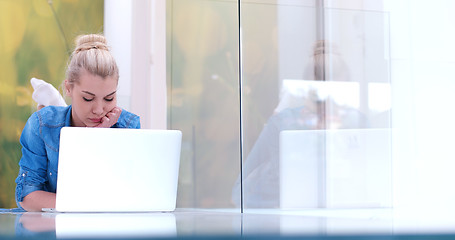 Image showing young women using laptop computer on the floor