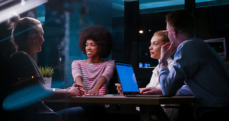 Image showing Multiethnic startup business team in night office