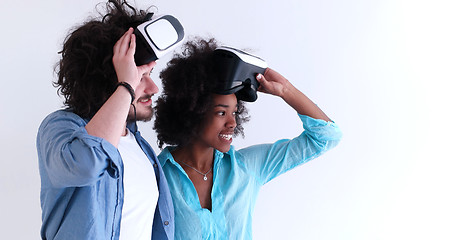 Image showing multiethnic couple getting experience using VR headset glasses