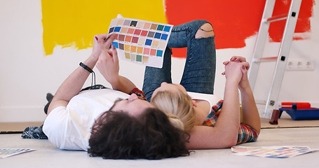 Image showing Happy young couple relaxing after painting