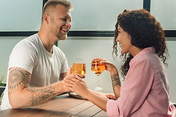 Image showing She said him yes. Closeup of young man kissing his wife hand while making marriage proposal outdoors.